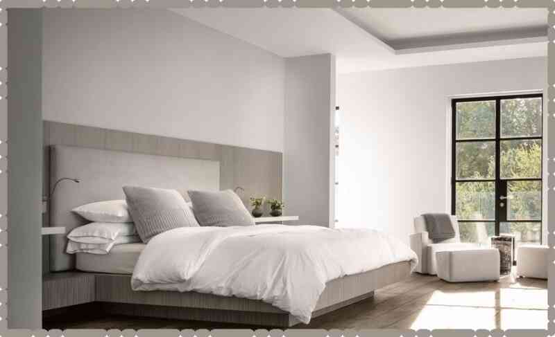 Açık griler bu şık minimalist yatak odasında parlak beyazlarla tamamlanmış.